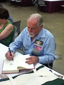 The grandmaster, Robert Silverberg, signing at the 71st Worldcon in San Antonio.